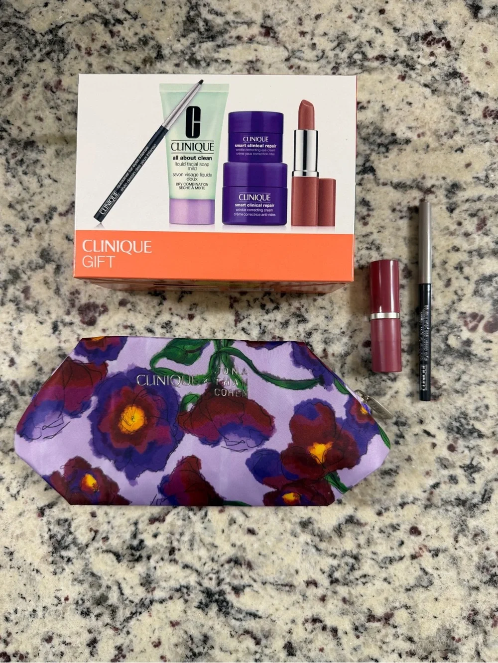 Clinique Makeup Set with Purple Floral Cosmetic Bag & extra lipstick / liner